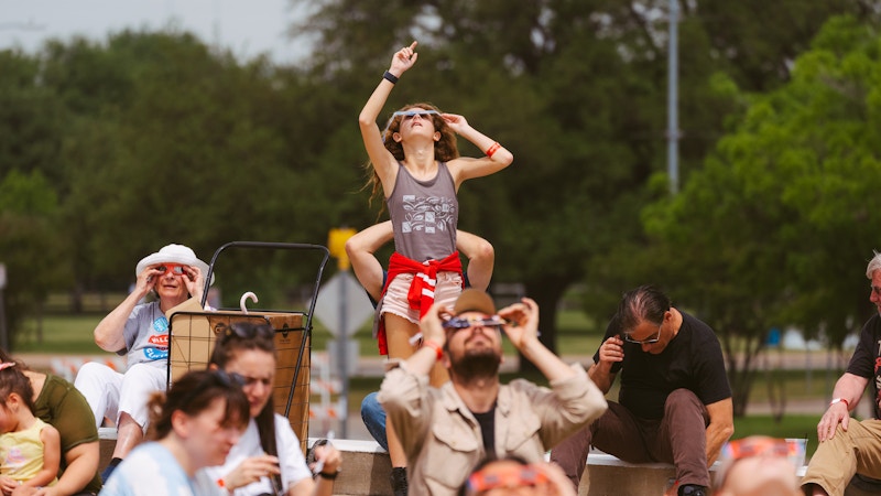 Attendees at the Simons Foundation’s flagship In the Path of Totality event in Austin, Texas, look up at the April 2024 solar eclipse.