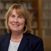 A portrait photo of Jill Pipher in front of bookshelves.