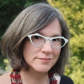 Portrait photo of Julianne Dalcanton against a forest scene.