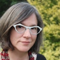 Portrait photo of Julianne Dalcanton against a forest scene.