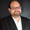 Man wearing white shirt and black suit jacket