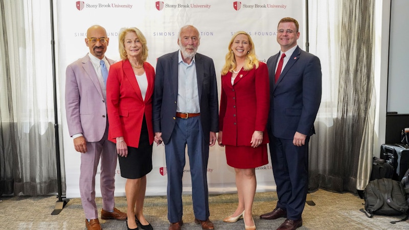 Marilyn Simons, Stony Brook University President Maurie McInnis, Jim Simons and Simons Foundation President David Spergel toast the announcement of the $500 million gift.