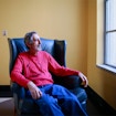 Avi Wigderson sits in a chair in the library at the University of California, Berkeley.