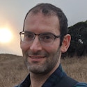 A portrait photo of Gregory Valiant.