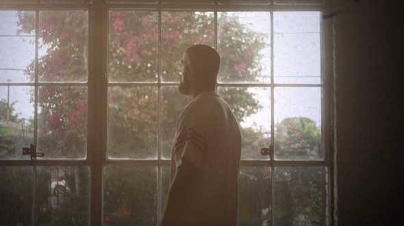 man facing a wall of windows